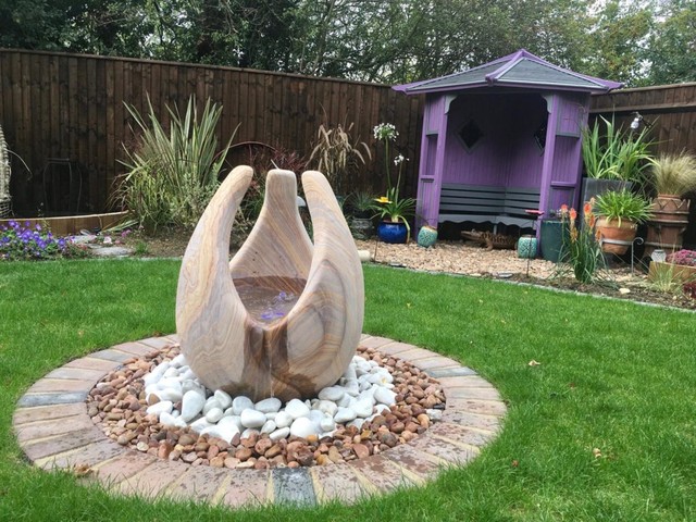 installing a garden water feature sculpted