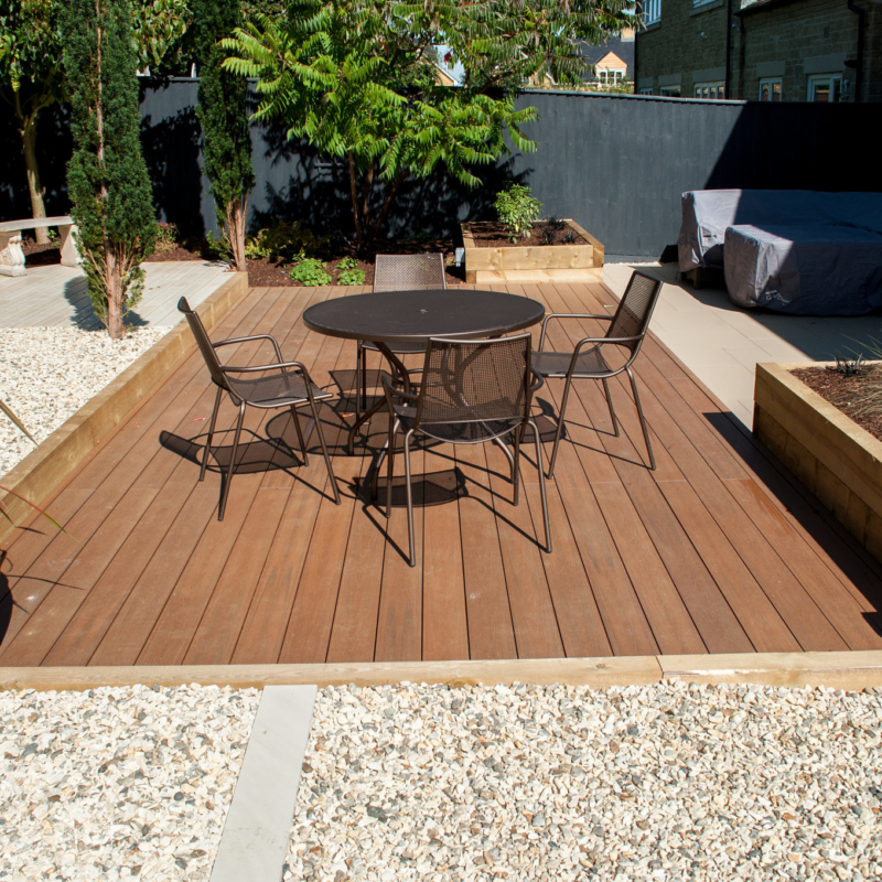 family garden design wooden decking with seating
