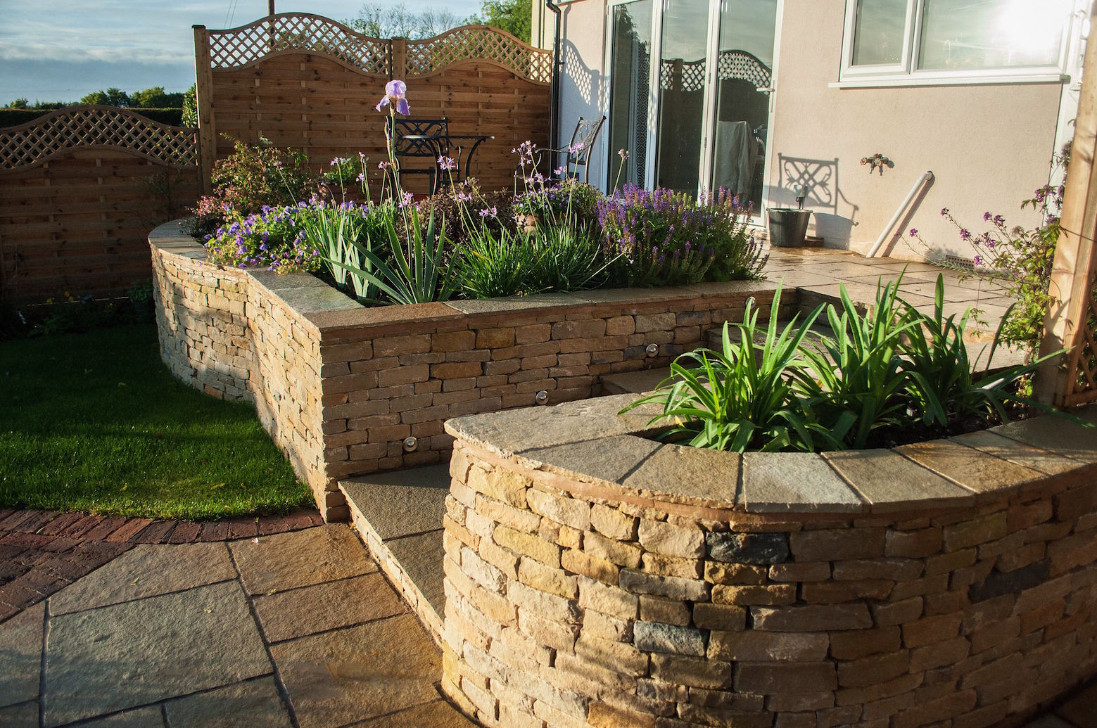 small garden with dry stone wall